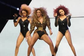 Beyonce (centre), with backing dancers, performing on the Pyramid Stage at the Glastonbury Music Festival in 2011. Beyonce gets set to release her first full-length solo album since 2016, a sprawling 16-track record featuring contributions from her husband Jay-Z, Drake, producer Skrillex and The-Dream.