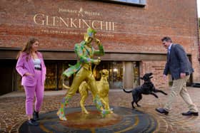 Ramsay Borthwick, Distillery Manager and his dog Skyelar mark the opening of the new Glenkinchie Distillery visitor experience in East Lothian, by unveiling a new Striding Man statue featuring historic distillery dog, Bruce. He is joined by Edinburgh-based artist Angela Johnston, who created the statue design.