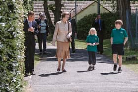 Princess Anne is shown around Harmeny by two of the children