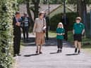 Princess Anne is shown around Harmeny by two of the children