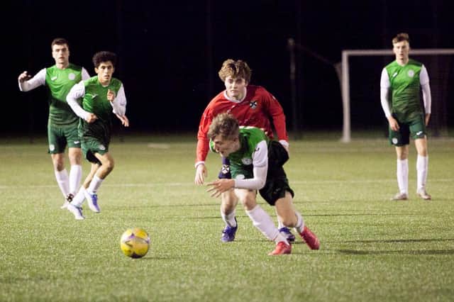 Josh O'Connor attempts to escape the attentions of an Edinburgh University opponent. Picture: Maurice Dougan