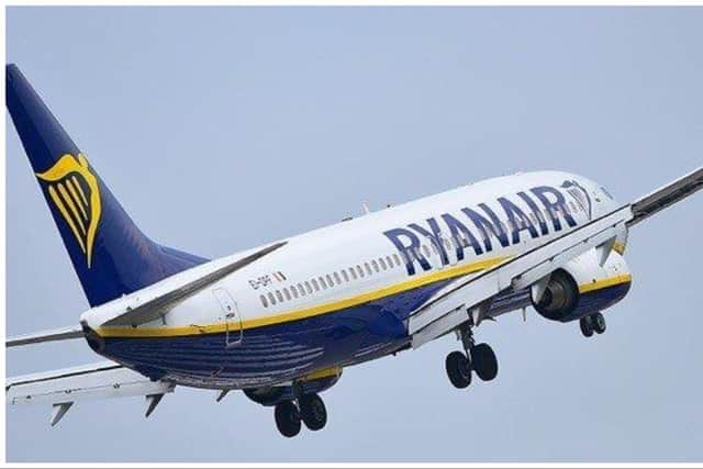 Passengers travelling on a Ryanair flight from Edinburgh to Tenerife were hauled off the aicraft by police after a fight broke out and bottles were thrown.
