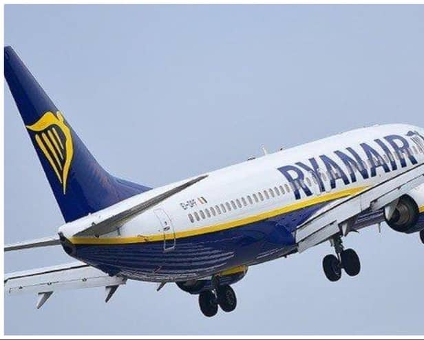Passengers travelling on a Ryanair flight from Edinburgh to Tenerife were hauled off the aicraft by police after a fight broke out and bottles were thrown.