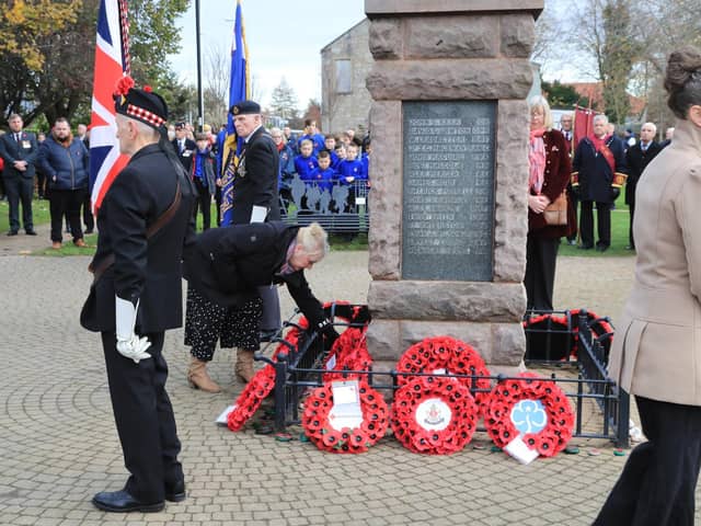 Loanhead Community Development Association Chairwoman Irene Hogg laying a wreath at the town's Remembrance Sunday event. Photo by Joe Gilhooley.