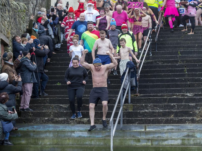 Eager participants make their way to the cold waters
