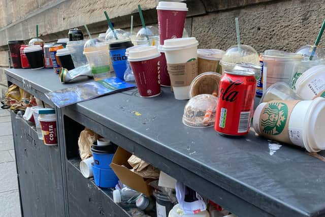 Drinks cups were stacked on top of the bins on Castlehill.