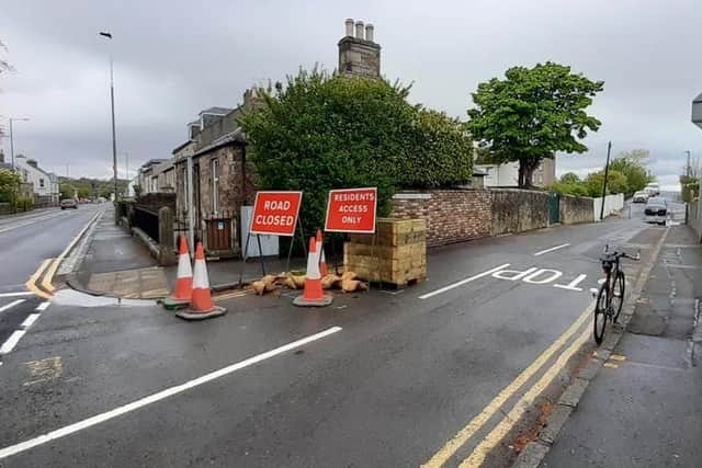 Planters have been introduced to calm traffic and congestion at school gates.
