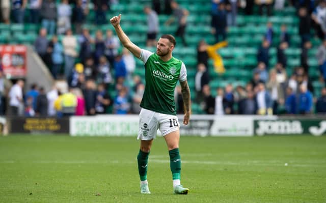 Hibs' match-winner Martin Boyle shows his appreciation to the fans after full-time. Picture: SNS