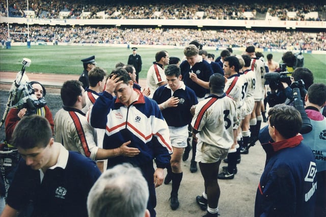 The players leave the field after the Scotland v England Calcutta Cup rugby match at Murrayfield in 1994. England won the match 15-14, with the only try of the match coming from Scotland's Rob Wainwright.