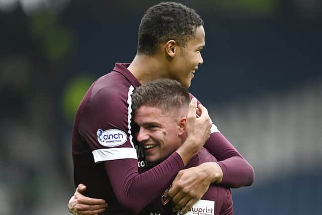 Toby Sibbick embraces Hearts team-mate Cammy Devlin at full-time in the Scottish Cup semi-final. Picture: SNS