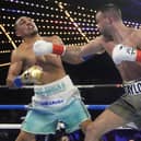 Scotland's Josh Taylor, right, punches Teofimo Lopez during the fourth round in New York, a fight Lopez would go on to win. (AP Photo/Frank Franklin II).