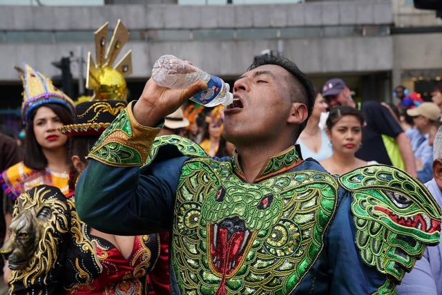 Performers cooled down with a drink of water after the parade.