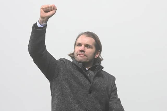 Robbie Neilson raises a celebratory fist towards the Hearts fans after a 1-0 victory over Dundee at Dens Park. Picture: SNS