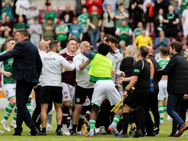 Players from both teams clash in the centre circle