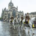 The Riding of the Marches parade makes its way up the Royal Mile past St Giles' Cathedral.