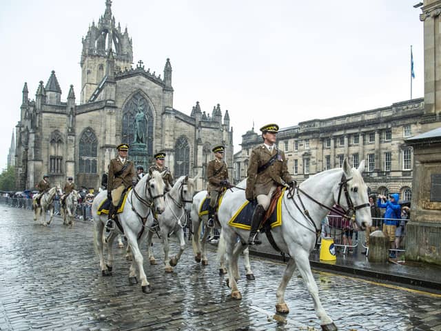 The Riding of the Marches parade makes its way up the Royal Mile past St Giles' Cathedral.