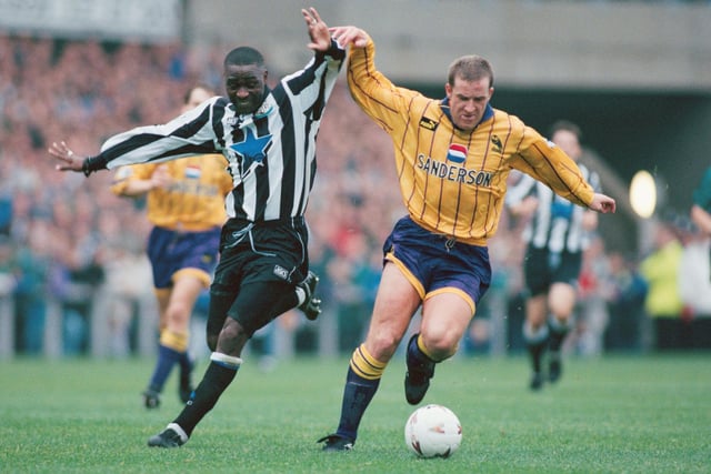 Peter Atherton does battle with Newcastle United striker Andy Cole in October 1994.