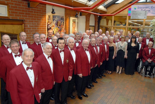 Members of Mansfield and District Male Voice Choir pictured in 2009 with soloist Daniela Hursthouse, before the start of their concert at the Palace Theatre