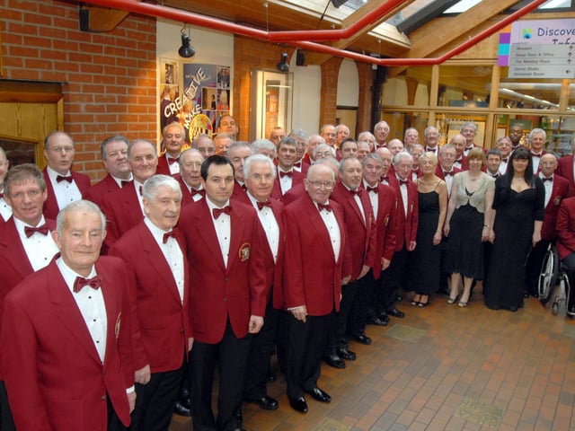 Members of Mansfield and District Male Voice Choir pictured in 2009 with soloist Daniela Hursthouse, before the start of their concert at the Palace Theatre