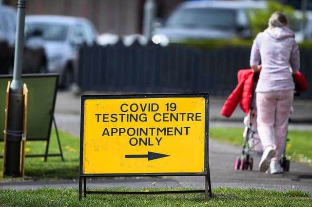 A woman walks past a testing centre for NHS staff in Grangemouth, Scotland. Picture: Getty