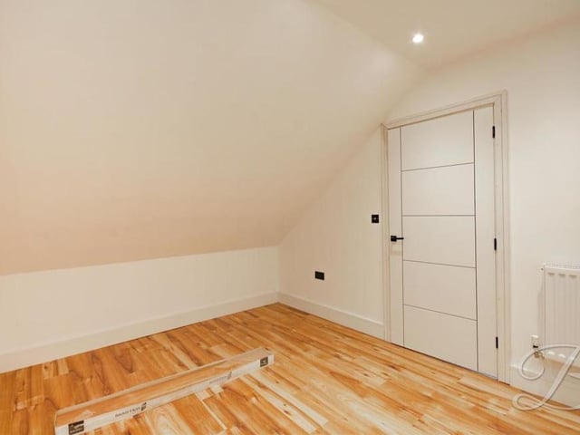Another upstairs room which, like everywhere else in the house, is fitted with matte black touches and a neutral colour palette which make it a home to dream about.