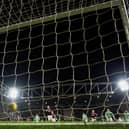 Tynecastle Park watches on as the ball travels agonisingly across the face of goal after striking Joe Hart's right-hand post. Picture: SNS