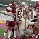 Managing Jim Jefferies, front-centre, with his victorious Hearts players after the 1998 Scottish Cup final. Picture: SNS