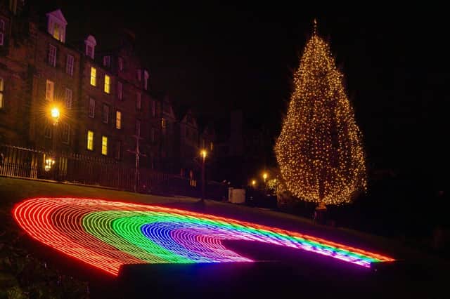 Christmas lights are switched on with a specially lit 18 metre Christmas Rainbow on the Mound to accompany the tree gifted by Norway (photo: Ian Georgeson Photography).