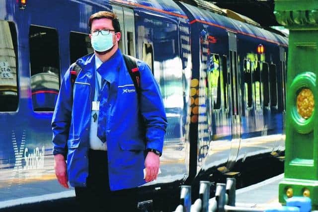 A ScotRail worker with face mask