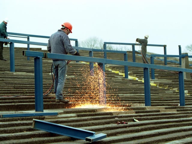 A welder makes sparks, working on the terracing at Murrayfield rugby stadium in Edinburgh, in March 1992.