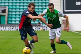 Jamie Murphy looks to get past Connor Randall during the 3-0 win against Ross County