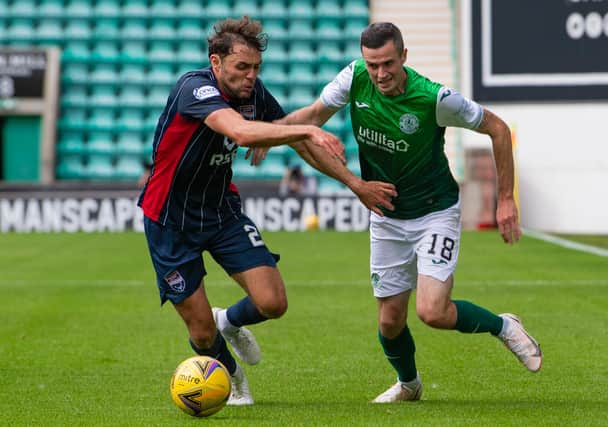 Jamie Murphy looks to get past Connor Randall during the 3-0 win against Ross County