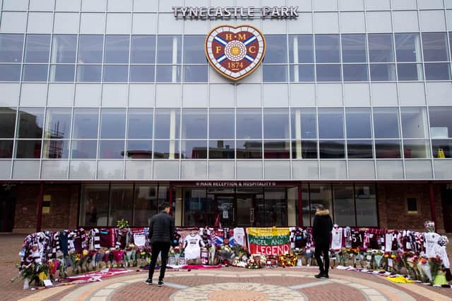 Tributes to Marius Zaliukas are left in front of Tynecastle Park after the cup-winning captain's death in 2020. Picture: SNS