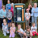 Children and staff from Kidz Stop next to one of the newly installed litter picking boards.