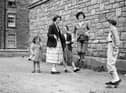 Girls playing skipping ropes in Lapicide Place, Leith, in August 1957