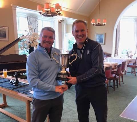 Edinburgh Summer League secretary Gordon McSorley, left, presents the trophy to David Miller after Duddingston's win in the final at Bruntsfield Links. Picture: Edinburgh Summer League