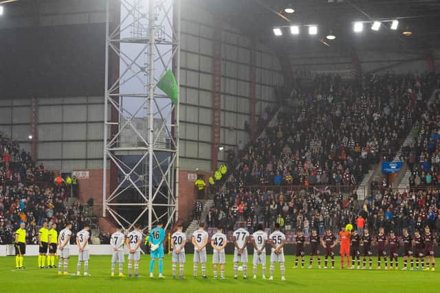Both sides take part in a minute's silence after the announcement of the Queen passing away during the Europa Conference League match between Hearts and Istanbul Basaksehir at Tynecastle. Picture: SNS