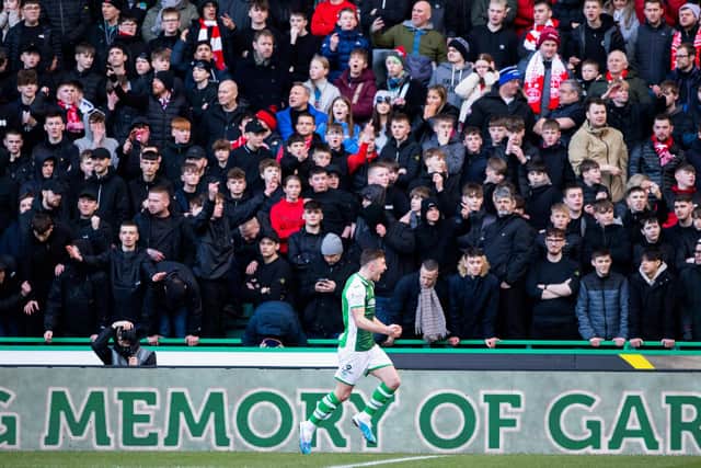 Josh Campbell celebrates in front of a dismayed Aberdeen away crowd after opening the scoring. Picture: SNS