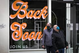 Sign that reads "Back Soon" in the window of a closed shop in Edinburgh city centre, as lockdown measures for mainland Scotland continue picture: PA/Jane Barlow