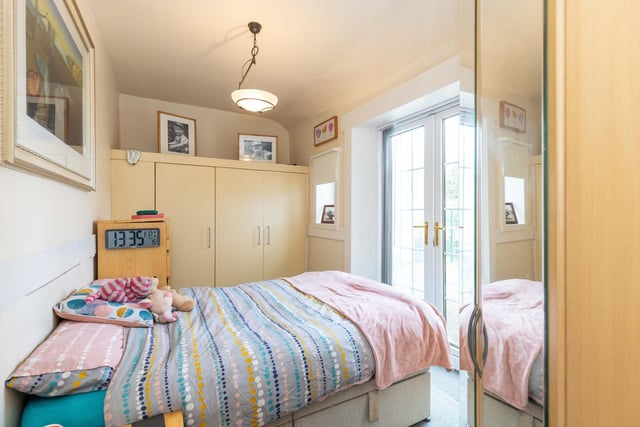 This double bedroom has French doors to the garden.
