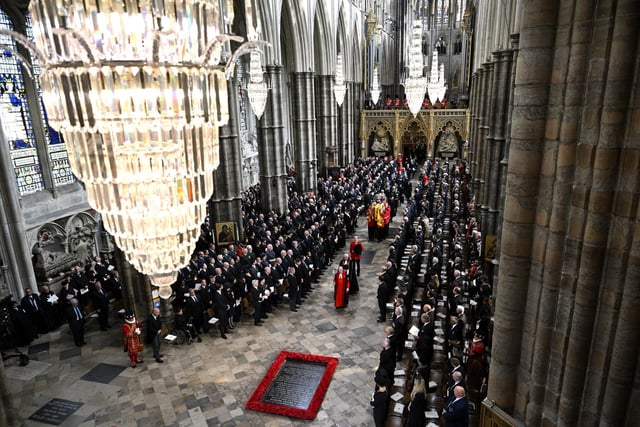 The coffin of Queen Elizabeth II with the Imperial State Crown resting on top of it departs Westminster Abbey during the State Funeral. (Photo by Gareth Cattermole/Getty Images)