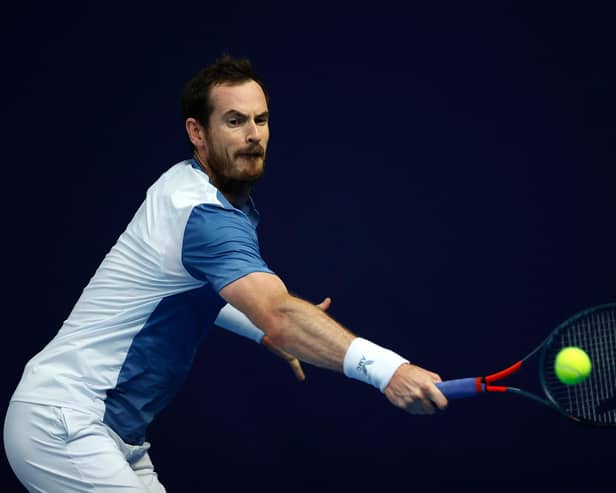 Andy Murray plays a backhand against Kyle Edmund at the Schroders Battle of the Brits event at Roehampton.