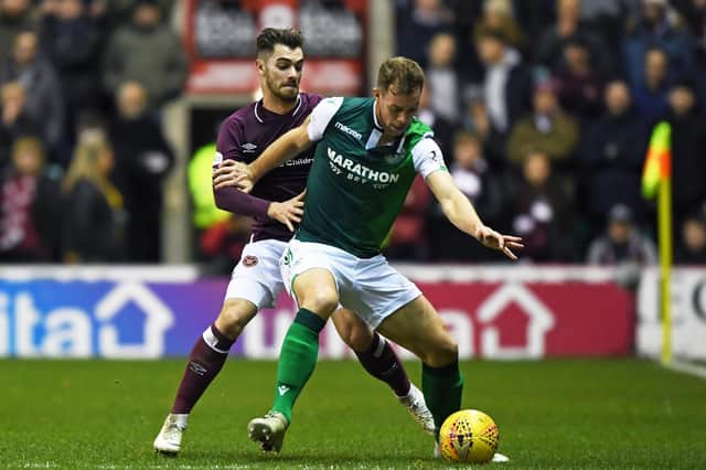 Steven Whittaker (R) in action with Hearts' Ben Garuccio during an Edinburgh derby in 2018. Pic: Paul Devlin, SNS Group