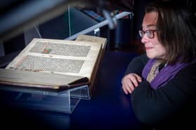 Head of rare books Helen Vincent with the National Library's copy of the Gutenberg Bible, which is going on display in its new Treasures gallery. Picture: Neil Hanna
