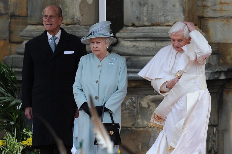 Pope Benedict XVI flew into Edinburgh Airport on September 16, 2010, at the start of his UK visit and was greeted on the tarmac by Prince Philip. He was driven to the Palace of Holyroodhouse, where he was welcomed by the Queen. But during the ceremony Pope Benedict lost his cap in the wind.