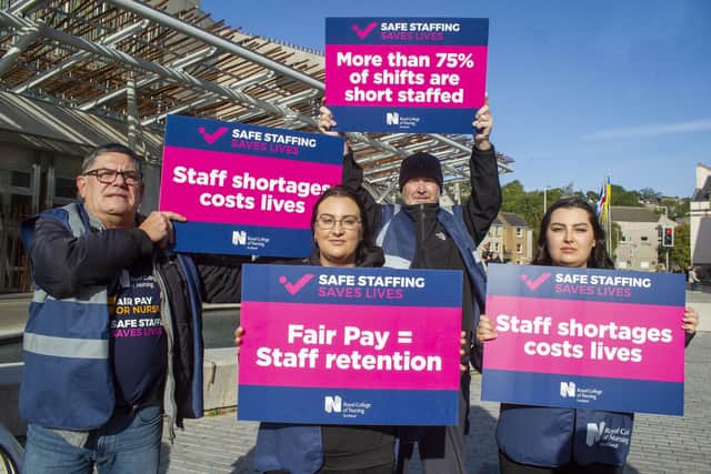 Members of the Royal College of Nursing demonstrate outside the Scottish Parliament.  Picture: Lisa Ferguson.