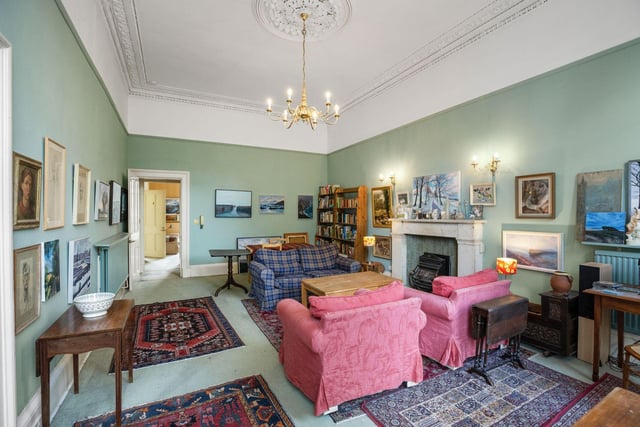 The flat has a large living and dining room which has floor to ceiling windows.