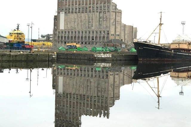 Demolition began on the  landmark grain silo at Leith docks to make way for Scotland's largest renewable hub .