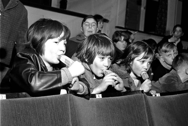 Children eating ice lollies at a special performance of 'The Sound of Music' at Edinburgh's Odeon Cinema in December 1965.