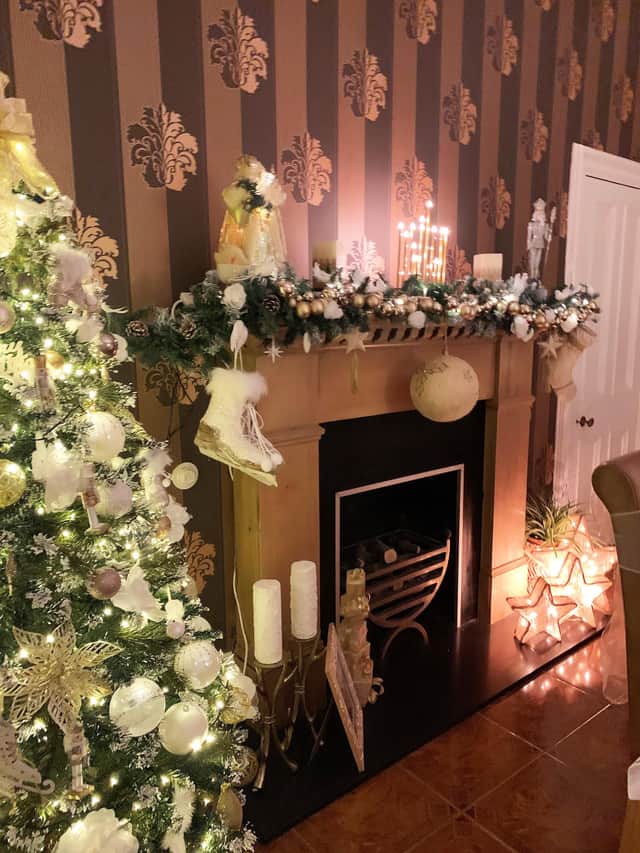 A sparkling snow and ice palette surround the fireplace at Ryseholm in Beith, North Ayrshire, one of the homes visited by the judges in their search for Scotland's Christmas Home of the Year.